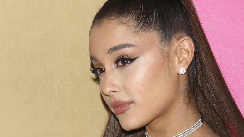 Ariana Grande wears a high ponytail