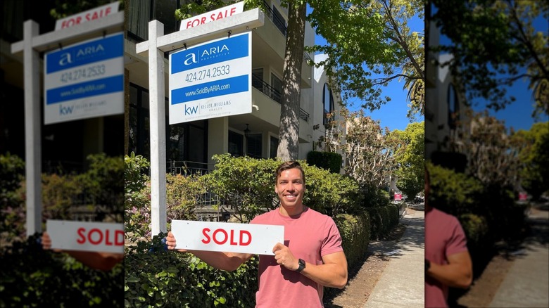 Joseph Baena standing in front of a property he sold