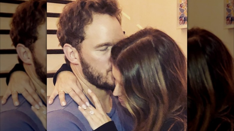 Chris Pratt and Katherine Schwarzenegger embracing and showing off engagement ring