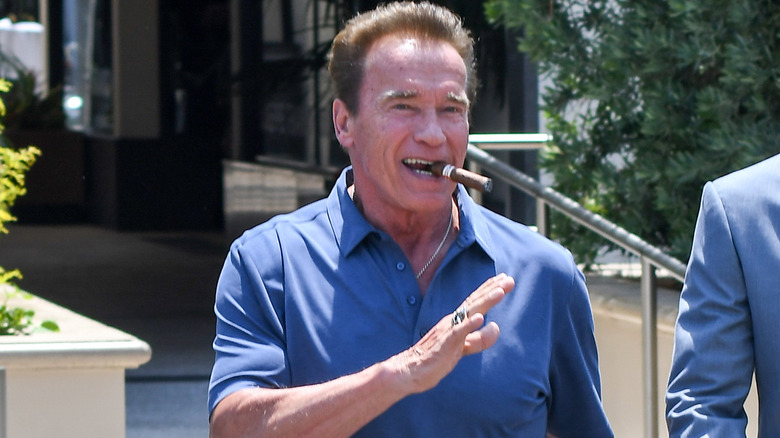 Arnold Schwarzenegger with a cigar in his mouth