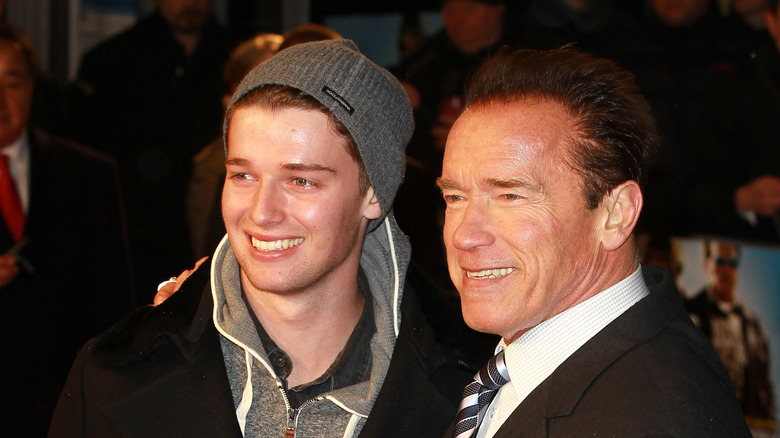 Patrick Schwarzenegger posing for pics with Arnold Schwarzenegger