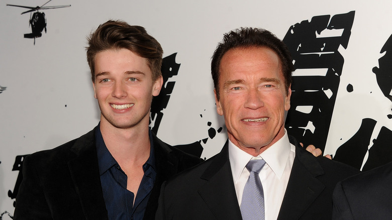 Arnold Schwarzenegger posing with his son Patrick