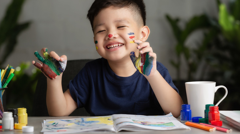 Boy with finger paint