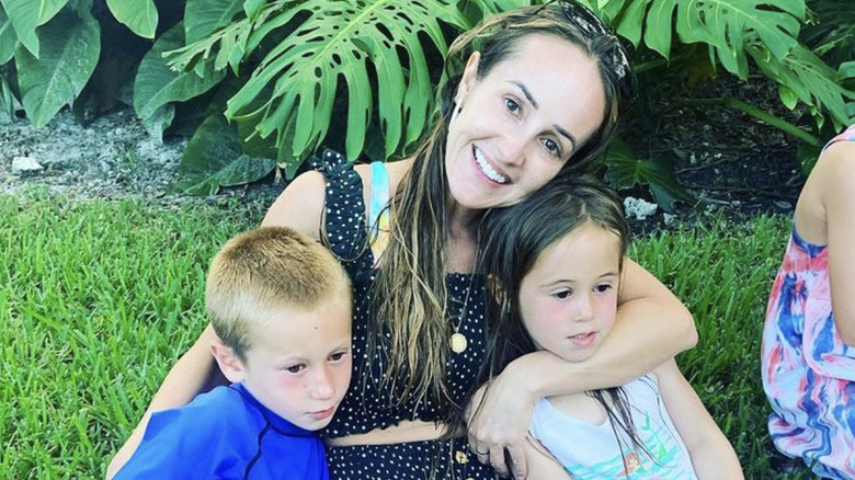 Ashley Hebert posing with her children