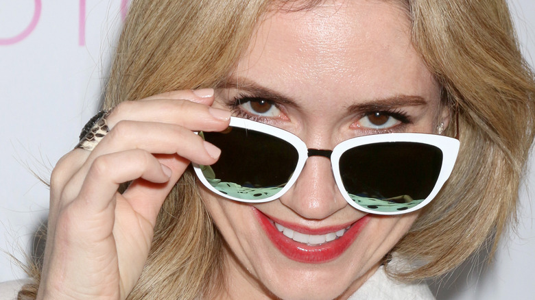 Ashley Jones wearing sunglasses and smiling