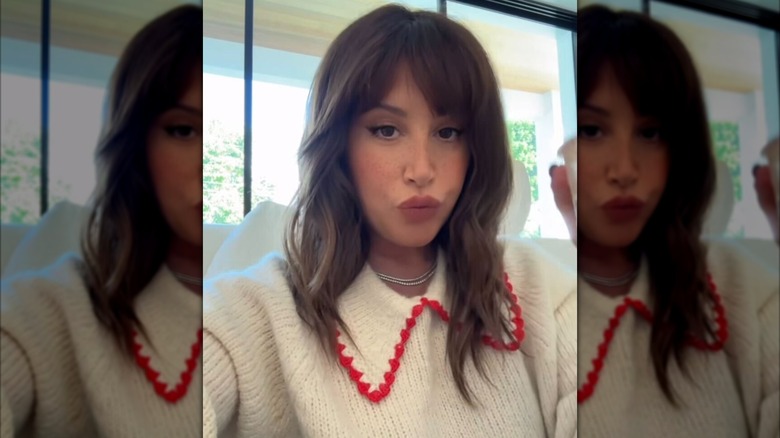 Ashley Tisdale pursing lips with brown hair