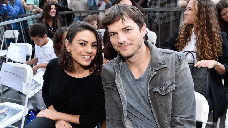 Ashton Kutcher and Mila Kunis posing together