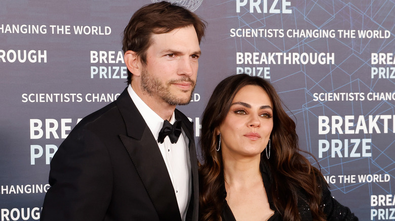 Ashton Kutcher and Mila Kunis at a red carpet