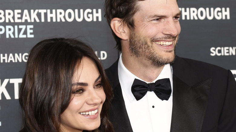 Ashton Kutcher and Mila Kunis smiling