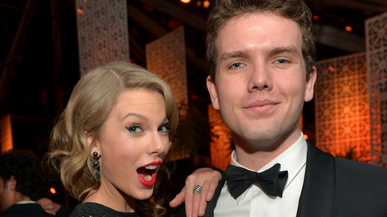 Taylor and Austin Swift posing together