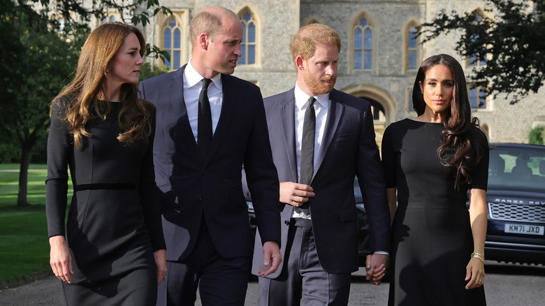 Kate Middleton, Prince William, Prince Harry, and Meghan Markle walking