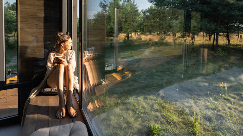 Woman sitting at window