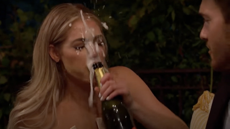 Kelsey Weier is sprayed with champagne