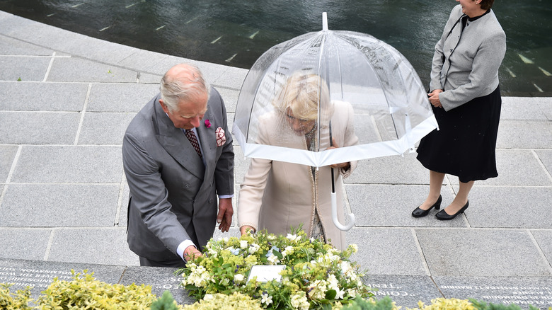 Prince Charles and Camilla Parker Bowles with umbrella