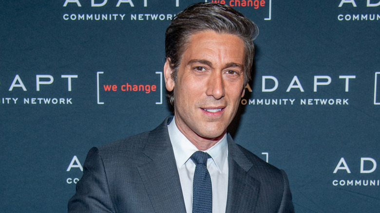 David Muir wearing a blue suit on the red carpet