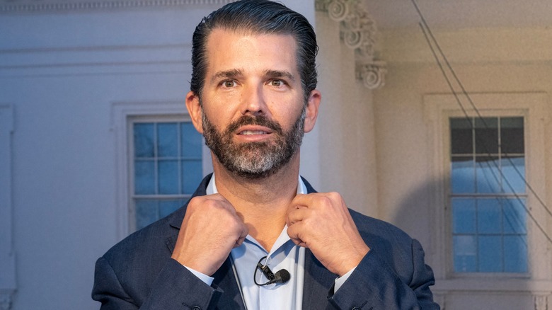 Donald Trump Jr. adjusting his collar