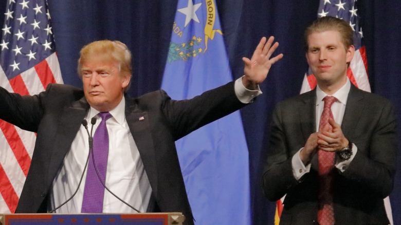 Eric Trump applauding Donald Trump