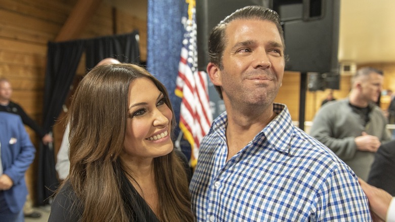 Kimberly Guilfoyle smiling with Donald Trump Jr.