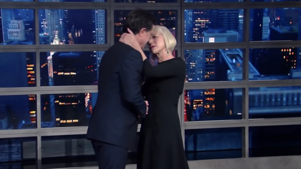 Helen Mirren kisses Stephen Colbert