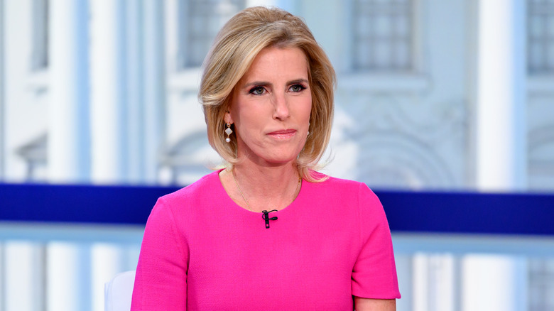 Laura Ingraham sitting at a desk