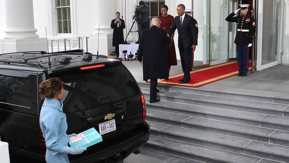 Melania Trump hanging way back as Donald Trump greets the Obamas