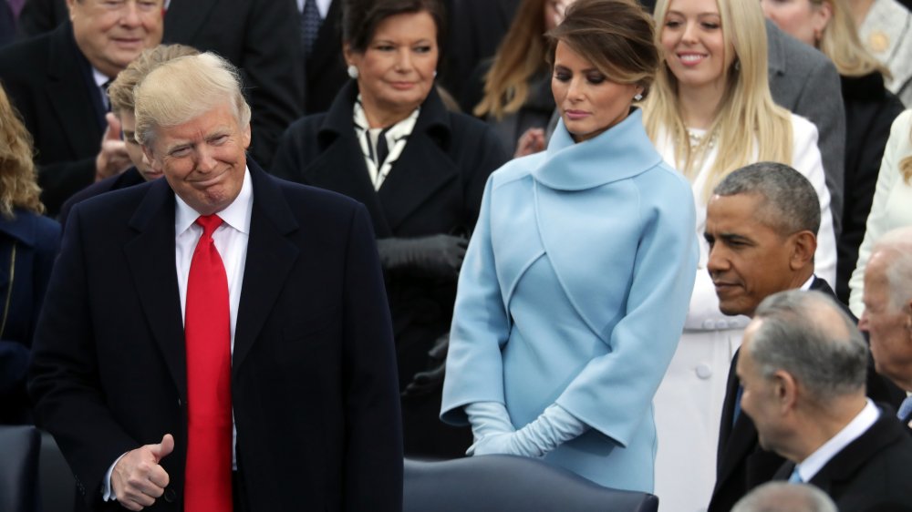 Melania Trump looking down while Donald Trump is sworn into office