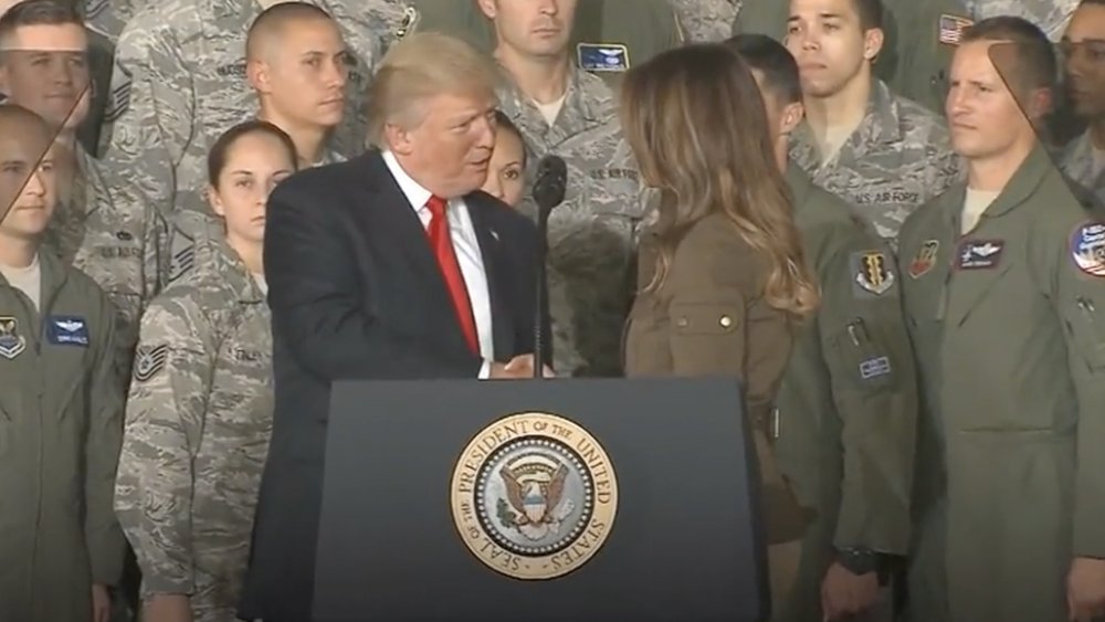 Donald Trump and Melania Trump shaking hands