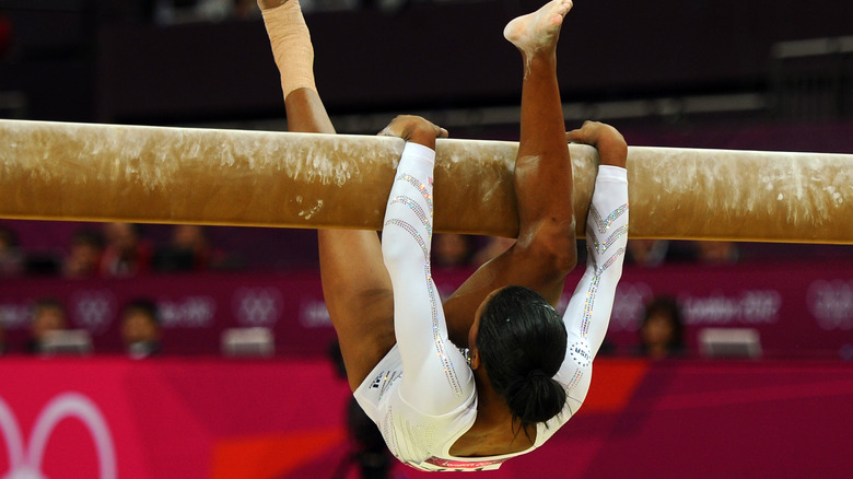 Gabby Douglas falls off beam