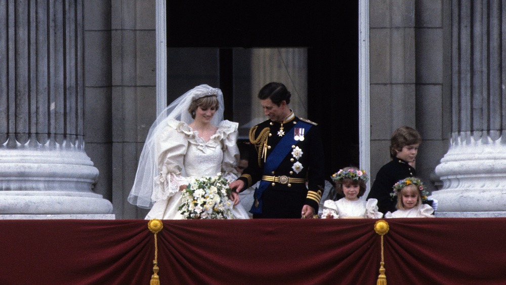 Prince Charles and Diana Spencer taking photos at wedding 
