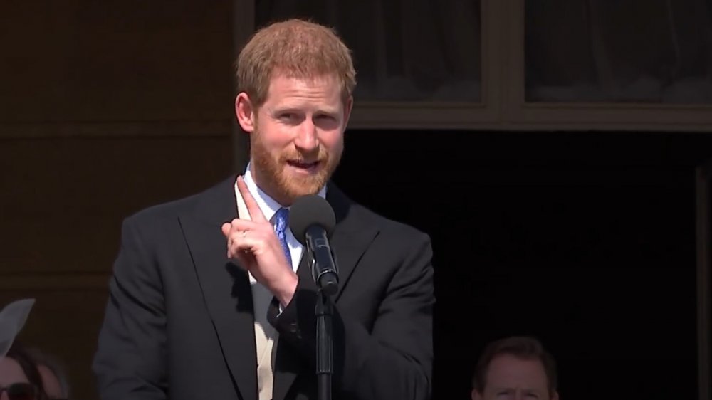 Prince Harry speaking into a microphone