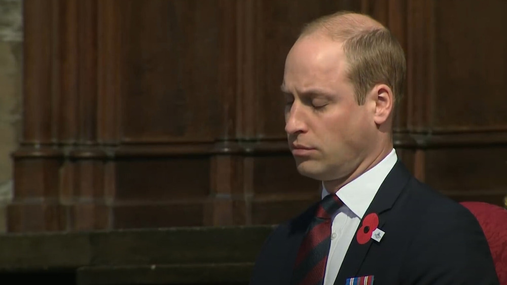 Prince William looking down