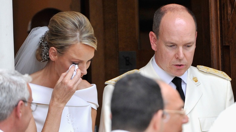 Princess Charlene crying beside Prince Albert at their wedding