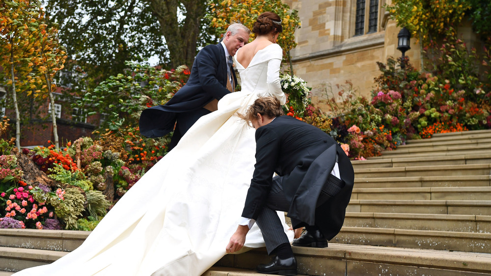 Princess Eugenie walking up stairs in her wedding dress