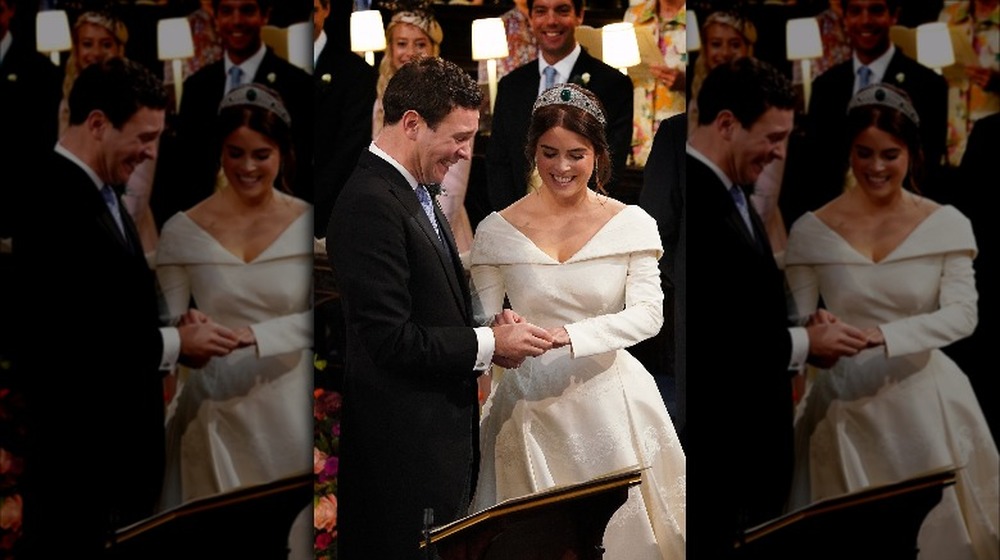 Princess Eugenie and her husband exchanging wedding rings