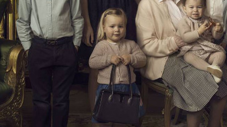 Mia Tindall holding Queen Elizabeth's bag