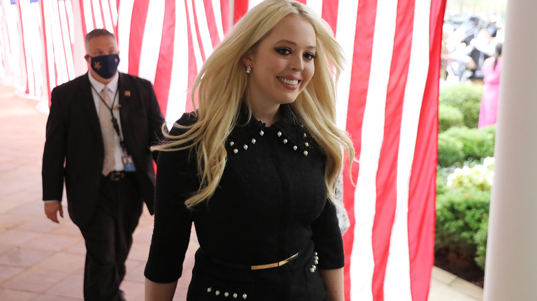 Tiffany Trump walking in front of bodyguard