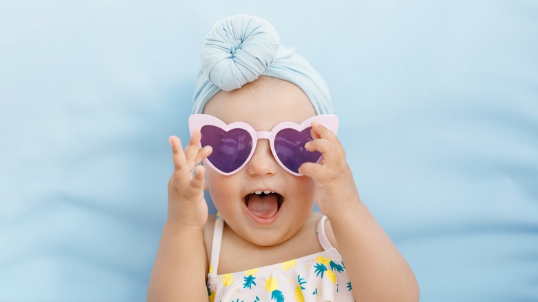 smiling baby in sunglasses 