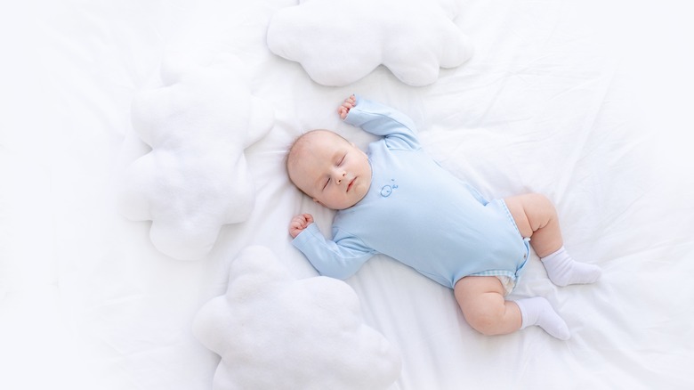 sleeping baby in blue 