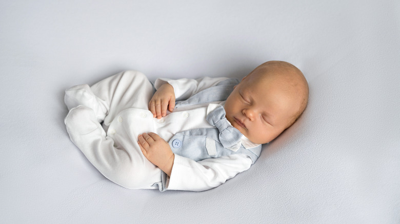 sleeping infant in bowtie 