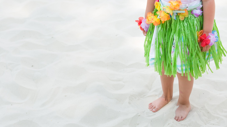 Child in grass skirt Hawaii