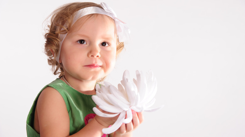 Baby holding a lotus