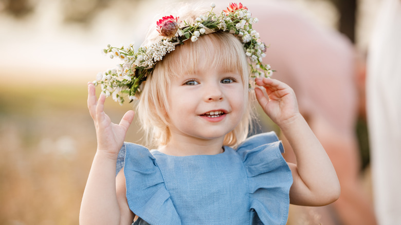 Baby wearing flower wreath