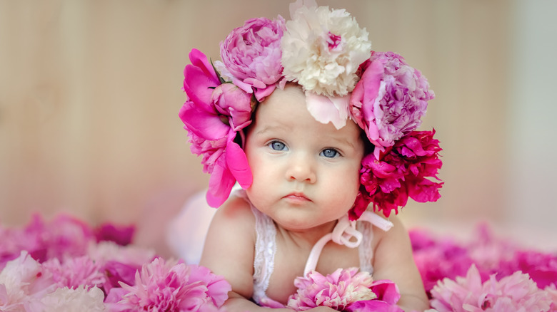 Baby surrounded by peonies