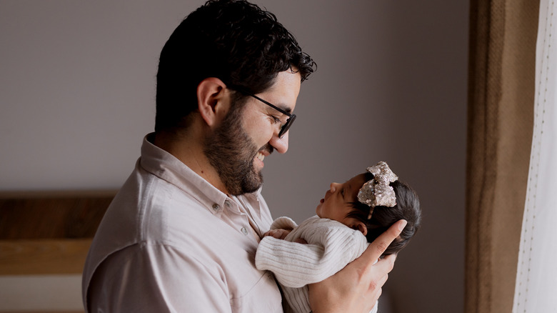 Dad holding baby girl