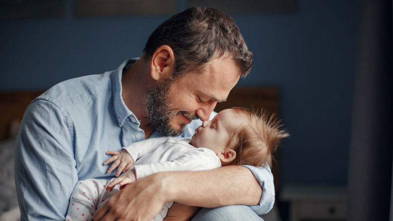 Dad holding baby