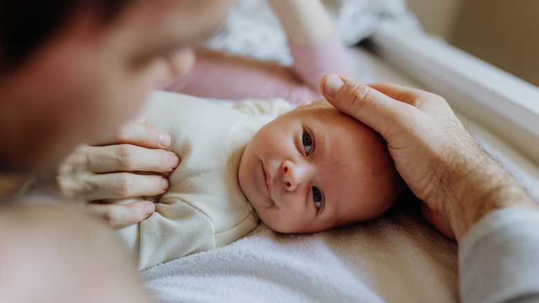 Baby looking at its mother 