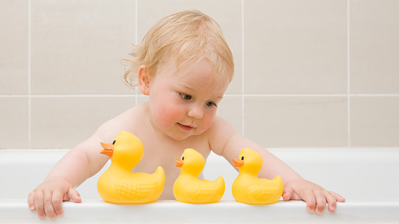 Baby boy with ducks