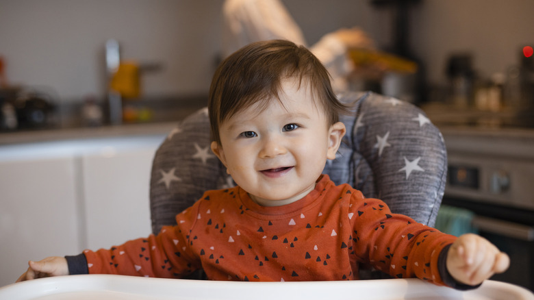 Baby boy in a high chair