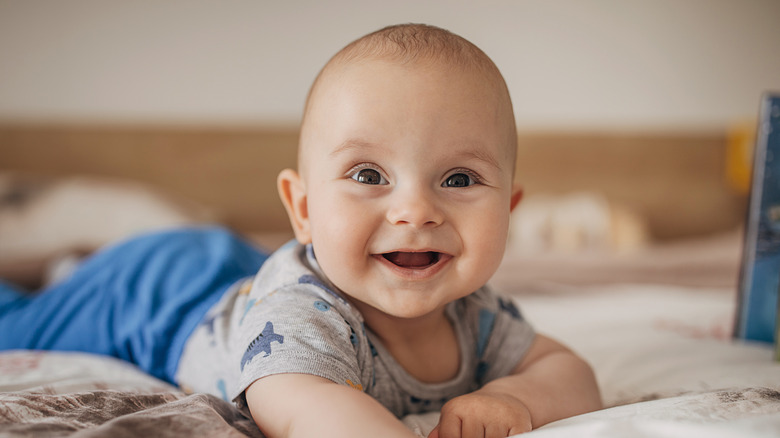 Happy baby on a bed
