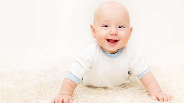 smiling baby tummy time
